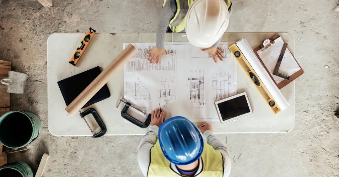 stock image of architect and engineer planning with blueprint